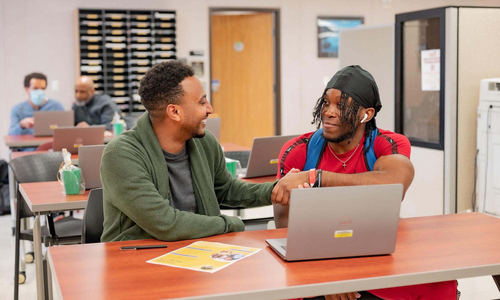 student meeting with an advisor during advising week